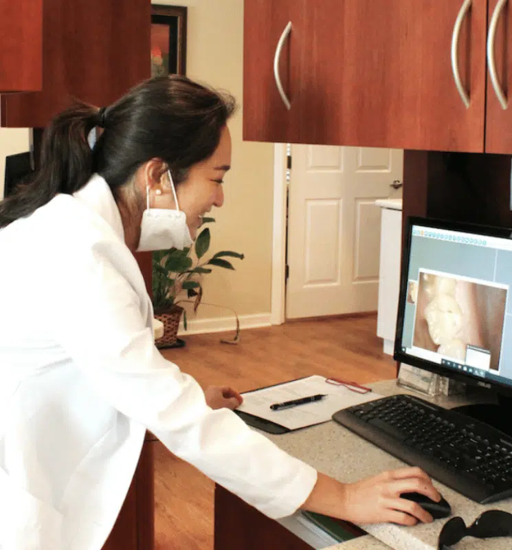 Dentist reviewing intraoral images on computer